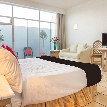 Capital O Hotel Villa Monini Puebla Extérieur photo